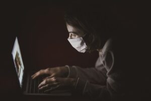 A woman researching wearing a medical mask